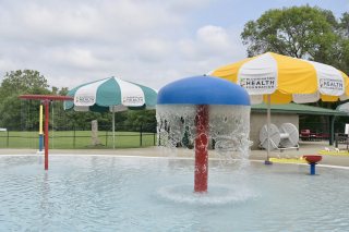 Mills Pool water feature and umbrellas.